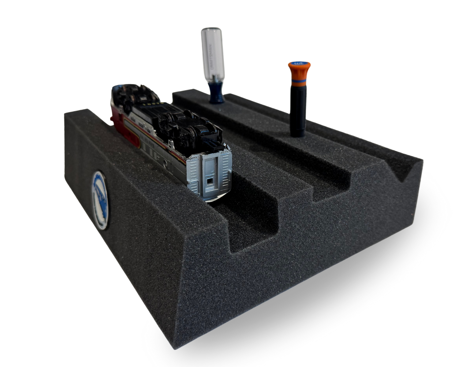 Model train on a foam block for maintenance