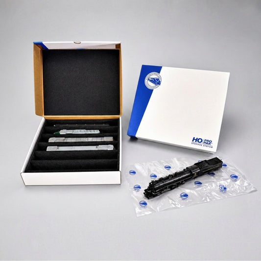 Pro Pak HO Compact box open beside its lid, with a steam locomotive on an Easy-Lift Sheet