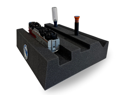 Model train on a foam block for maintenance 