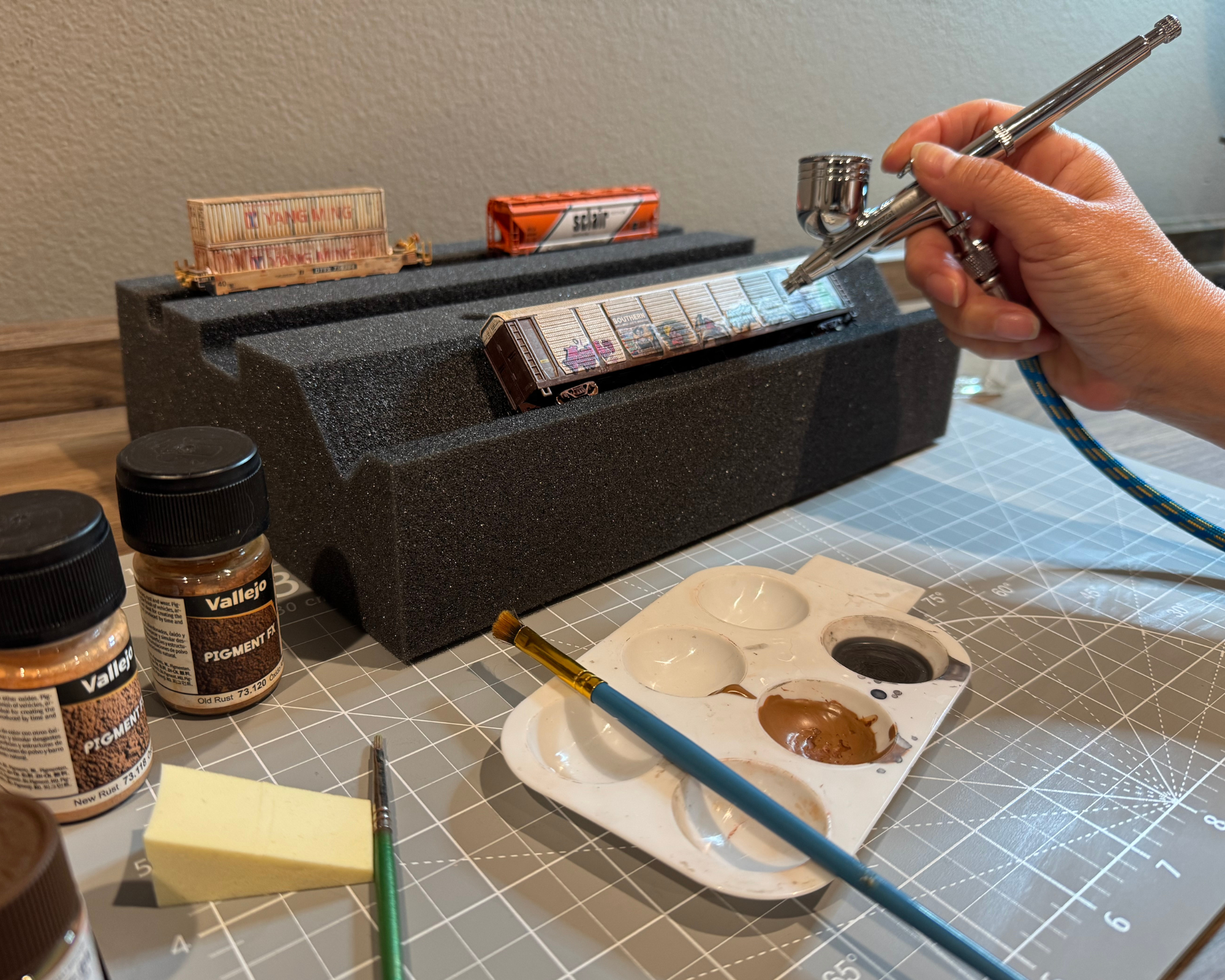 Weathering model train on the Original Handy Holder foam cradle