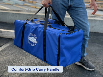 Man carrying the Pro Pak Carrying Case by its comfort-grip handles, outdoors
