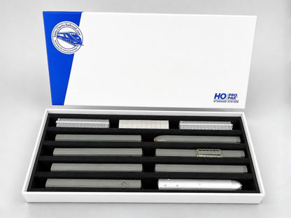 Pro Pak HO Standard box open with its lid behind, five channels of HO rolling stock stored upright